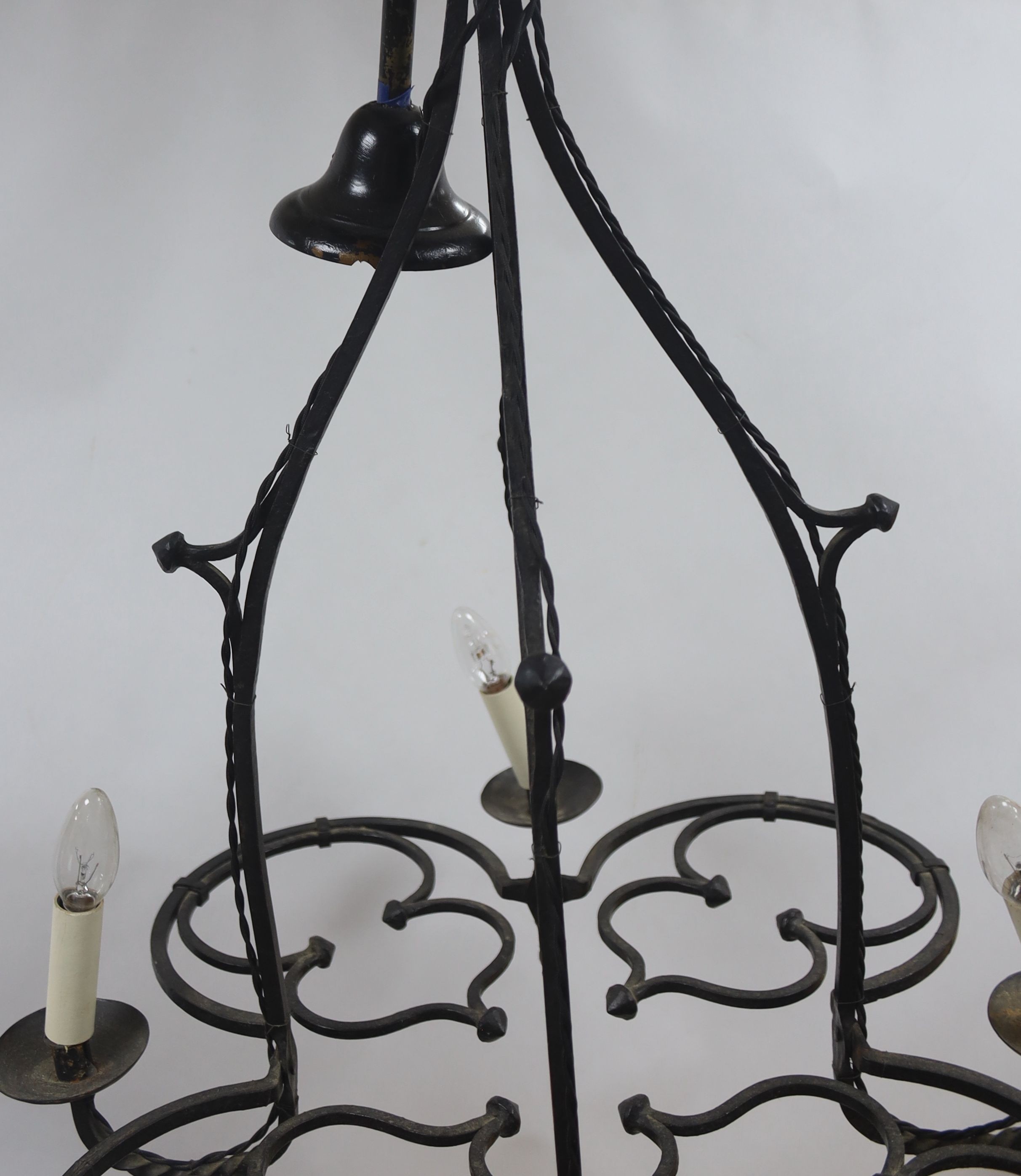 A wrought iron 4 light chandelier 80x63cm